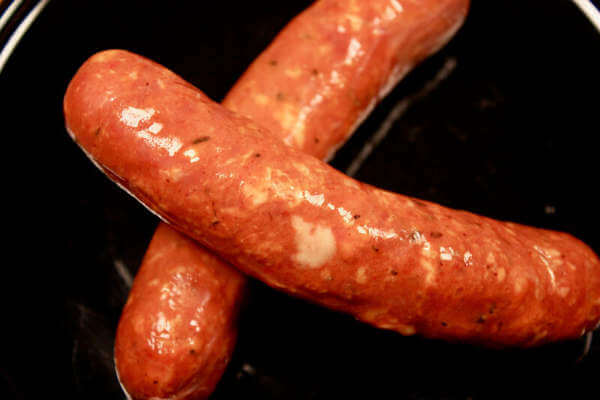 A Pair of Andouille Sausage Links On a Black Dish. Fresh Andouille Sausages, Ready for Some Cool Smoke!