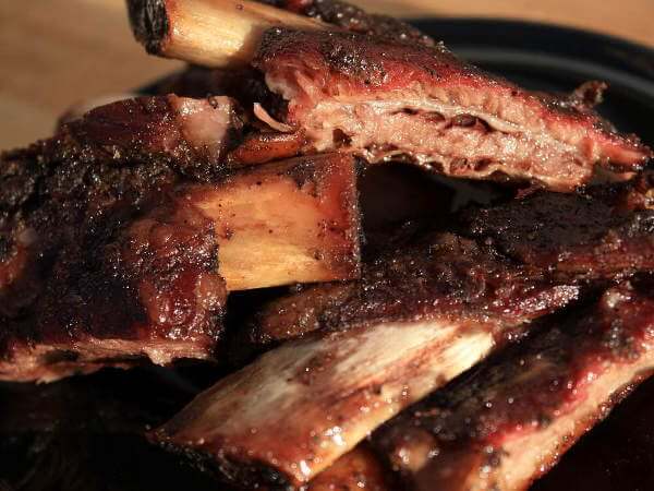 Gorgeous Beef Ribs On a Small Blue Plate, Just Out of The Smoker Mesquite Smoked Beef Ribs On Blue Plate, Ready To Eat!