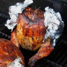 Grill Smoked Beer Butt Chicken, Wing Tips Wrapped In Foil To Prevent Burning