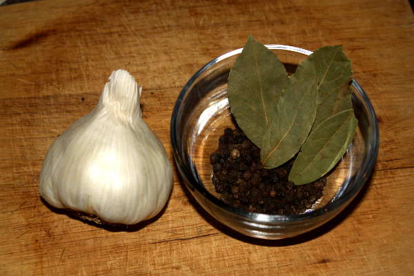 Black Peppercorns, Bay Leaves and a Head of Garlic That Will Season a Smoked Brisket