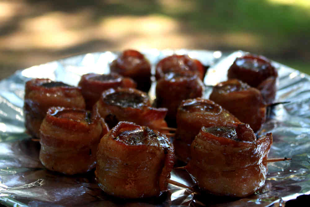 After grilling, allow these scrumptious little morsels to cool a bit so the syrup topping thickens. Mop up the syrup in left in the plate, or just lick it up like I do! Time to eat! These sweet bacon and sausage bites are indeed a tasty treat!