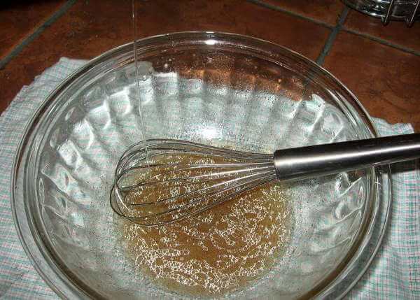 Whisking the Oil Into Marinade Ingredients, Coaxing the Combination To Form an Emulsion.