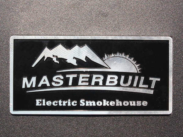 Masterbuilt Electric Smoker Logo Plaque, Showing Image of Sun Setting Behind Mountains