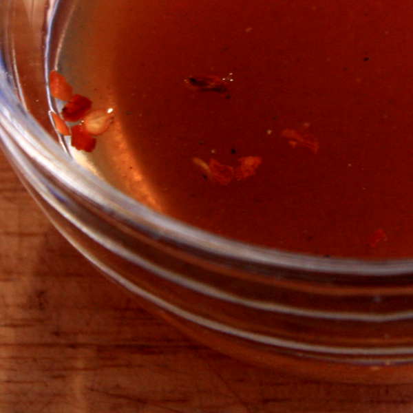 Spicy Vinegar Based BBQ Sauce In a Glass Bowl