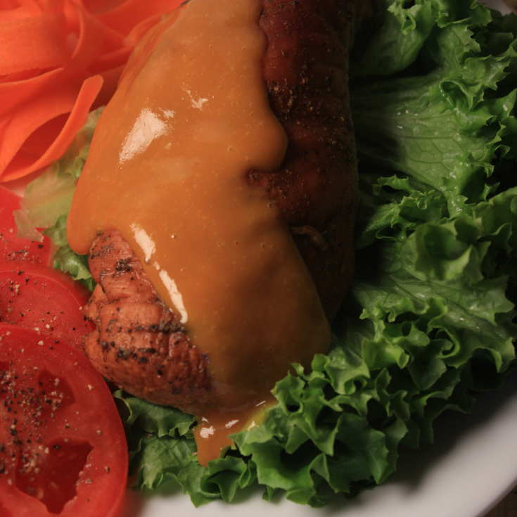 Tangy Yellow Mustard BBQ Sauce Dripping Down a Smoked Chicken Breast