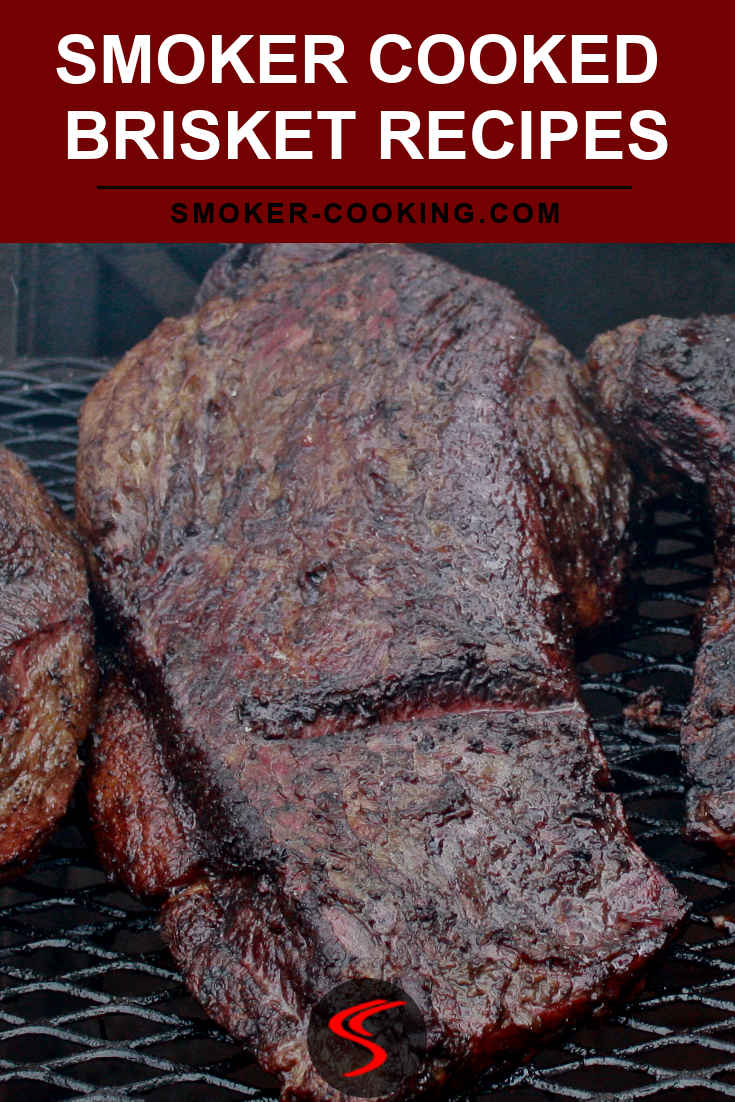 A huge beef brisket slowly smoking away on an open pit smoker.