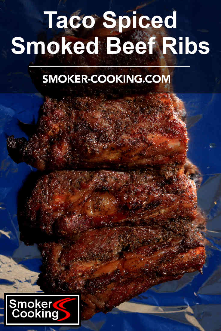 This smoked slab of beef ribs, laying on aluminum foil, is ready to be wrapped and placed again in the smoker. Pin for later