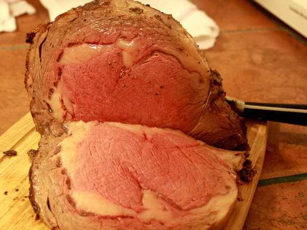 Sliced and Ready to Serve! This Grilled Beef Rib Roast Looks Great! Grilled Beef Rib Roast, Sliced, On Cutting Board