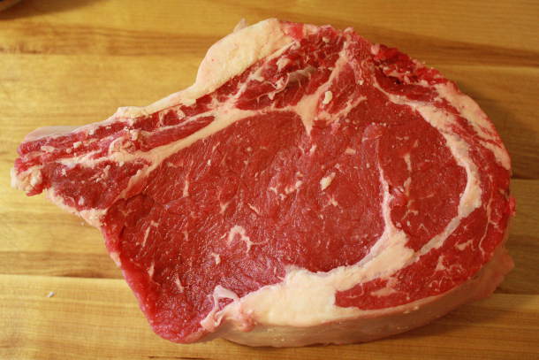 This Thick-Cut Ribeye Steak Will Be Seasoned Simply, Then Grilled to Perfection Uncooked Rib Eye Steak Ready For The Salt and Pepper
