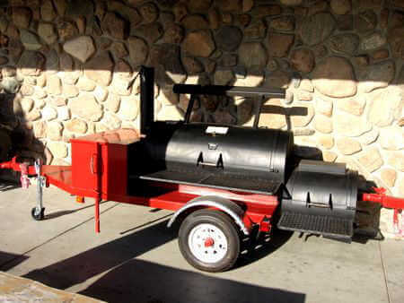  Wood Burning Pit Smoker Mounted on Red Single Axle Trailer