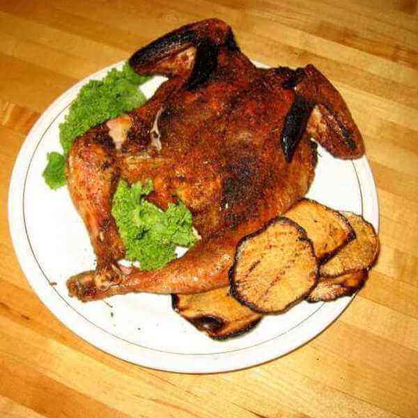 Quite a Chicken! This Spatchcock Chicken Is On a Plate With Lettuce And a Few Slices of Grilled Rutabaga