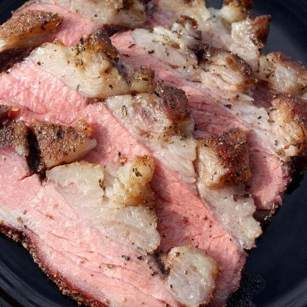 Marinated and Smoked Tri Tip, Sliced On Serving Plate