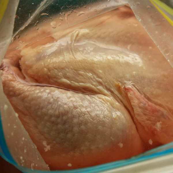 A Whole Chicken Being Brined In a Quality One Gallon Freezer Storage Bag