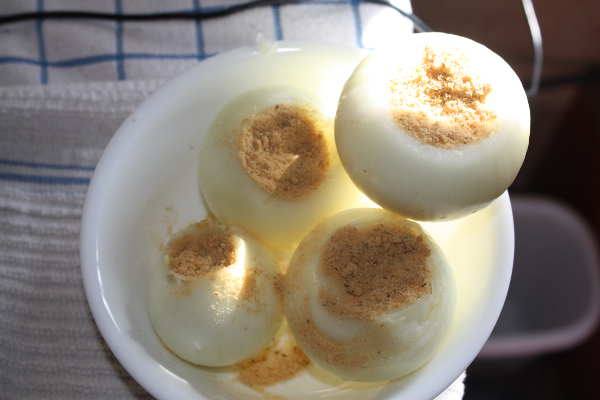 Seasoned Whole Onions Ready to Be Wrapped In Foil Whole Onions Filled With Butter and Powdered Chicken Bouillon