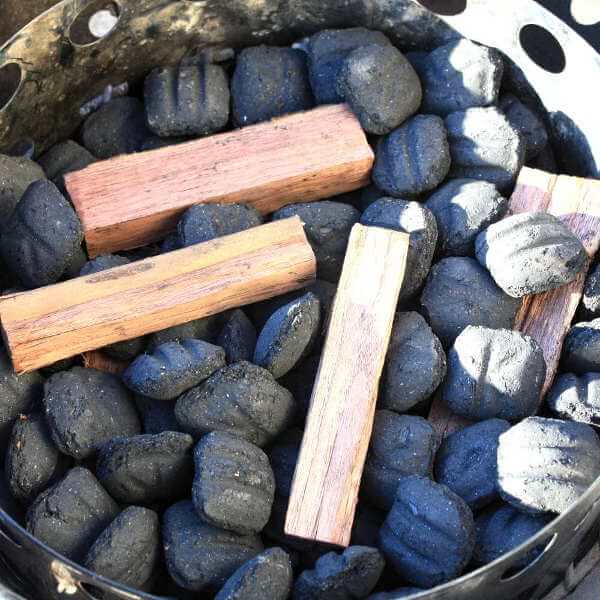 Chunks of hickory mixed with charcoal briquettes.