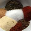 Mounds of Dry Rub Ingredients In a White Mixing Bowl